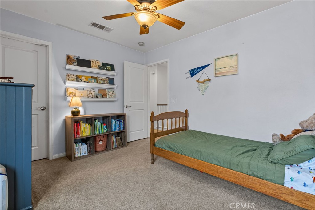 28356 Santa Rosa Lane Saugus, CA 91350 - Photo 20 of 50 a bedroom with furniture and a book shelf