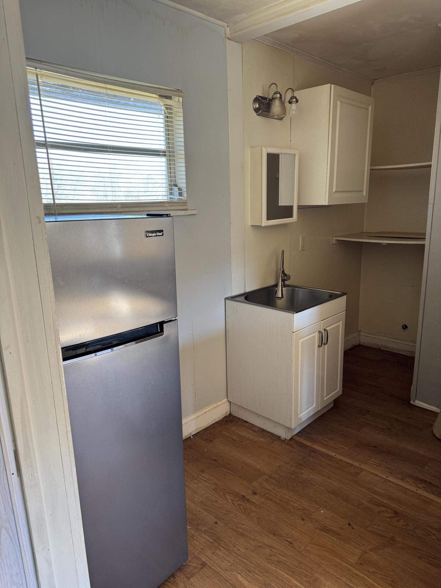 16365 Highway 58 Decatur, TN 37322 - Photo 3 of 5 a kitchen with a refrigerator a sink and a window