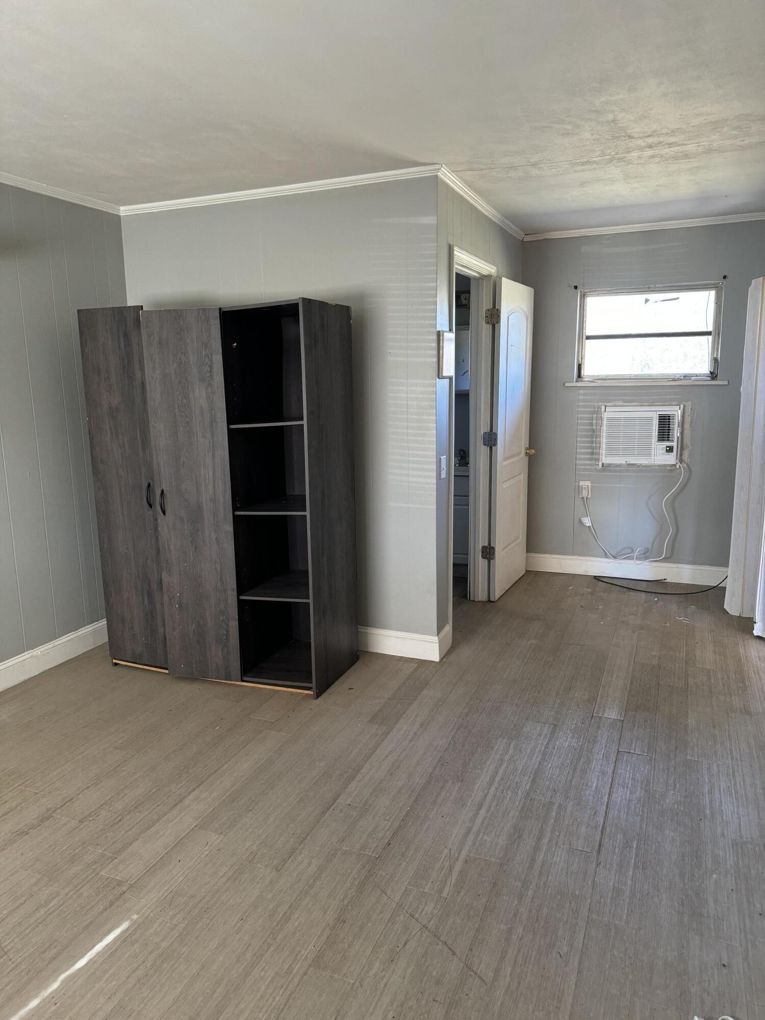 16365 Highway 58 Decatur, TN 37322 - Photo 4 of 5 an empty room with a wooden closet and windows