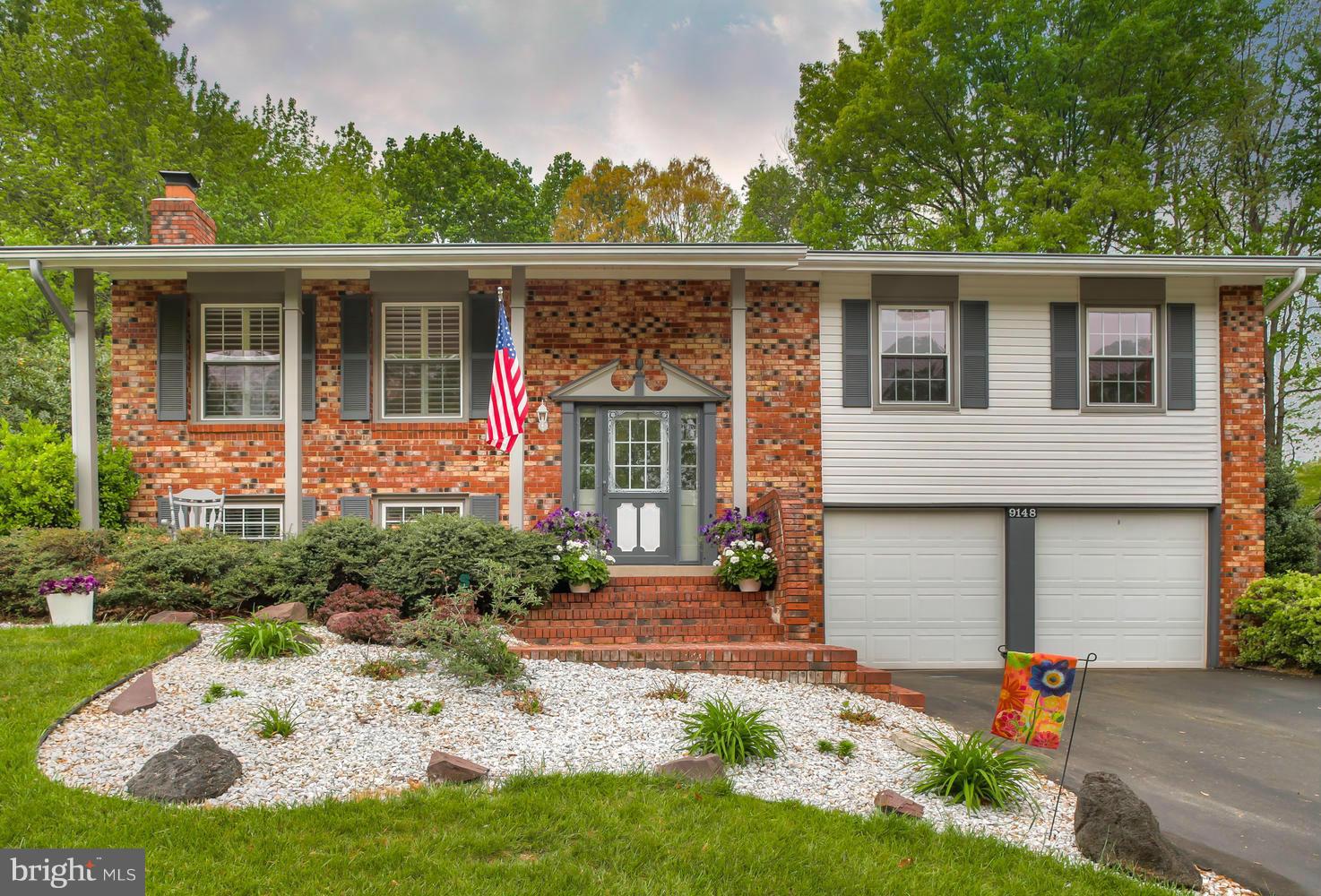 9148 Rockefeller Lane Springfield, VA 22153 - Photo 1 of 29 front view of house with a yard