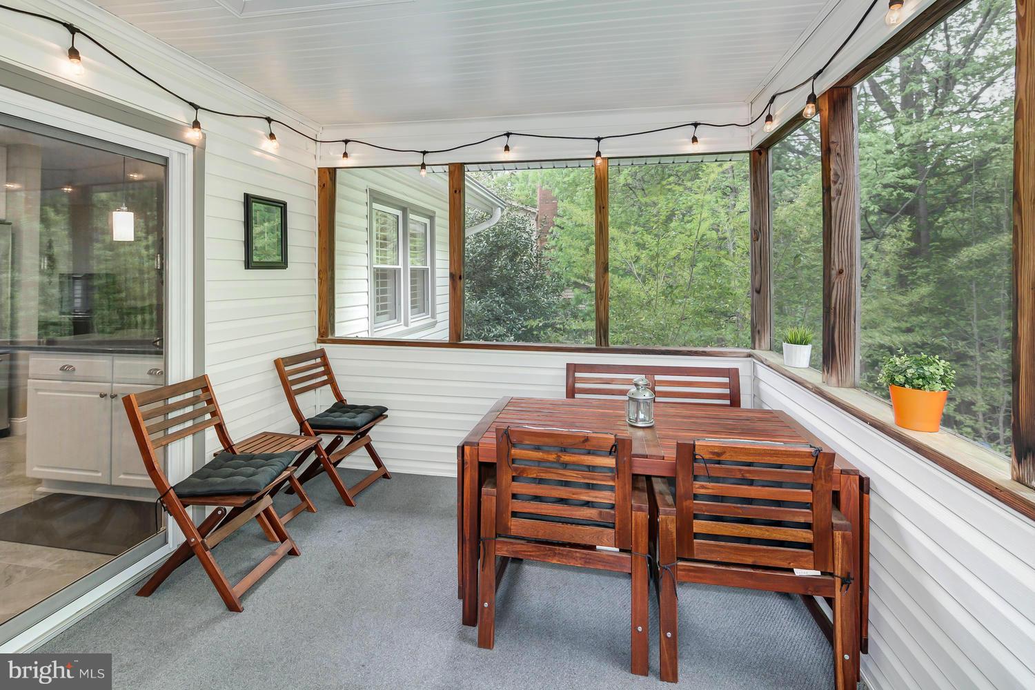 9148 Rockefeller Lane Springfield, VA 22153 - Photo 17 of 29 a room with wooden floor and furniture