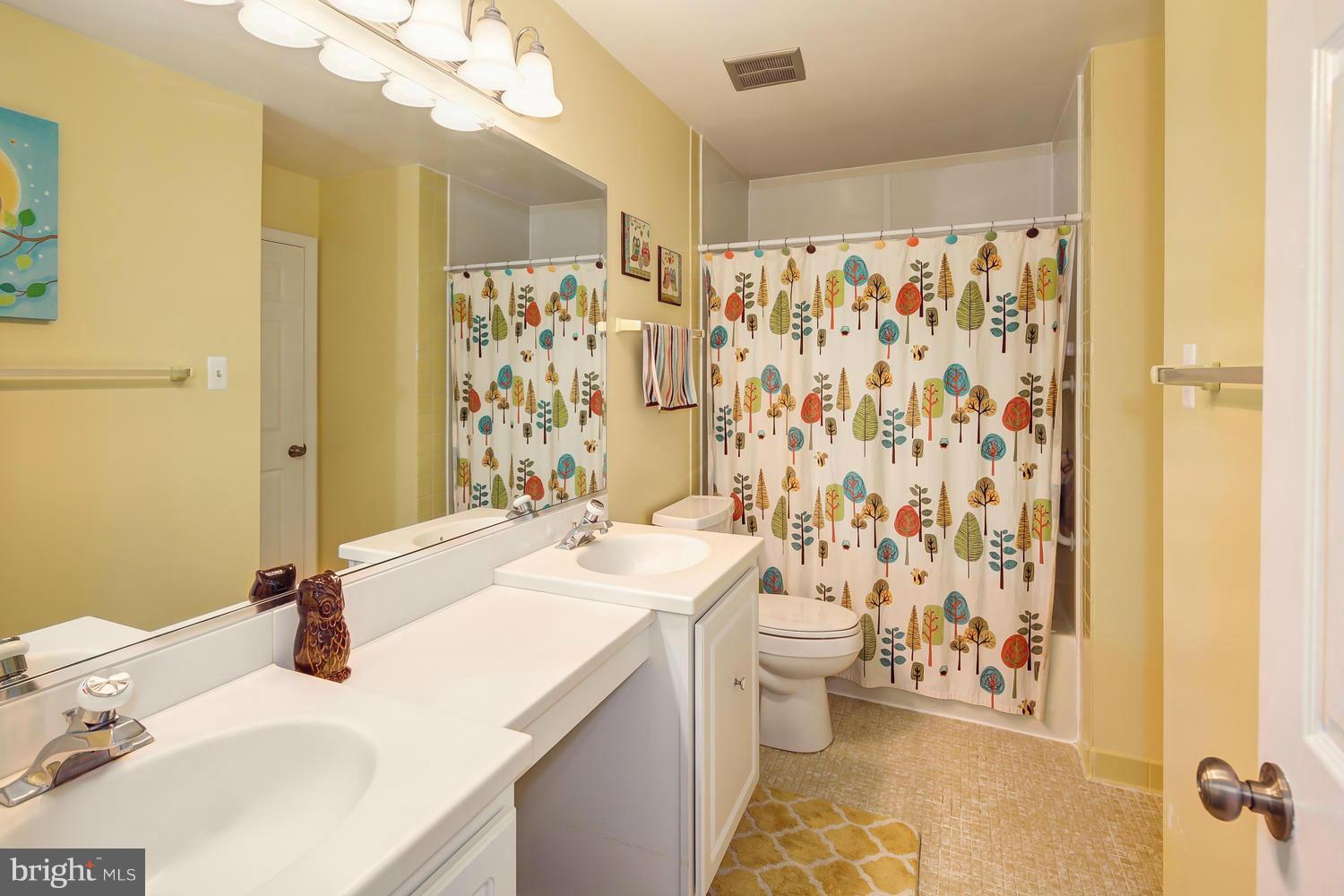 9148 Rockefeller Lane Springfield, VA 22153 - Photo 19 of 29 a bathroom with a sink toilet and shower