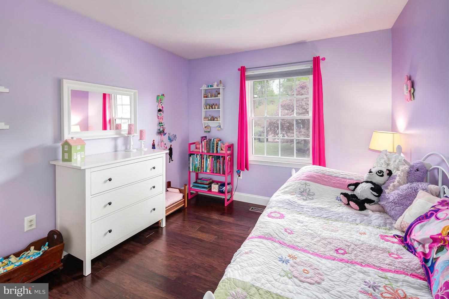 9148 Rockefeller Lane Springfield, VA 22153 - Photo 21 of 29 a bed room with a bed and a dresser