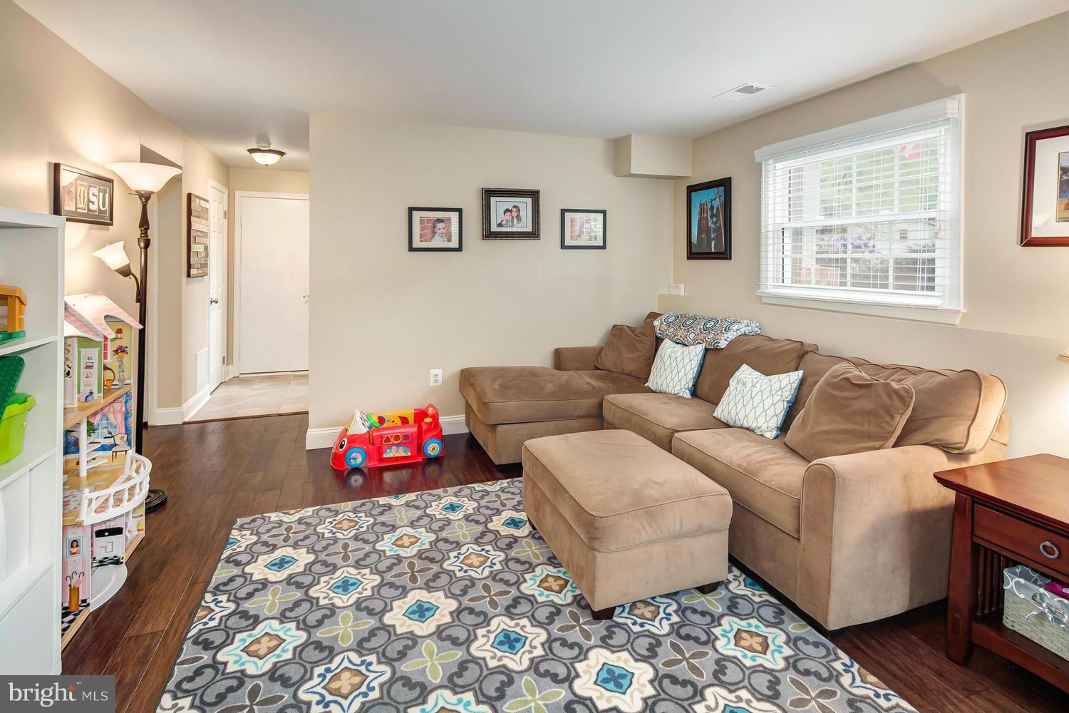 9148 Rockefeller Lane Springfield, VA 22153 - Photo 22 of 29 a living room with furniture and a couch