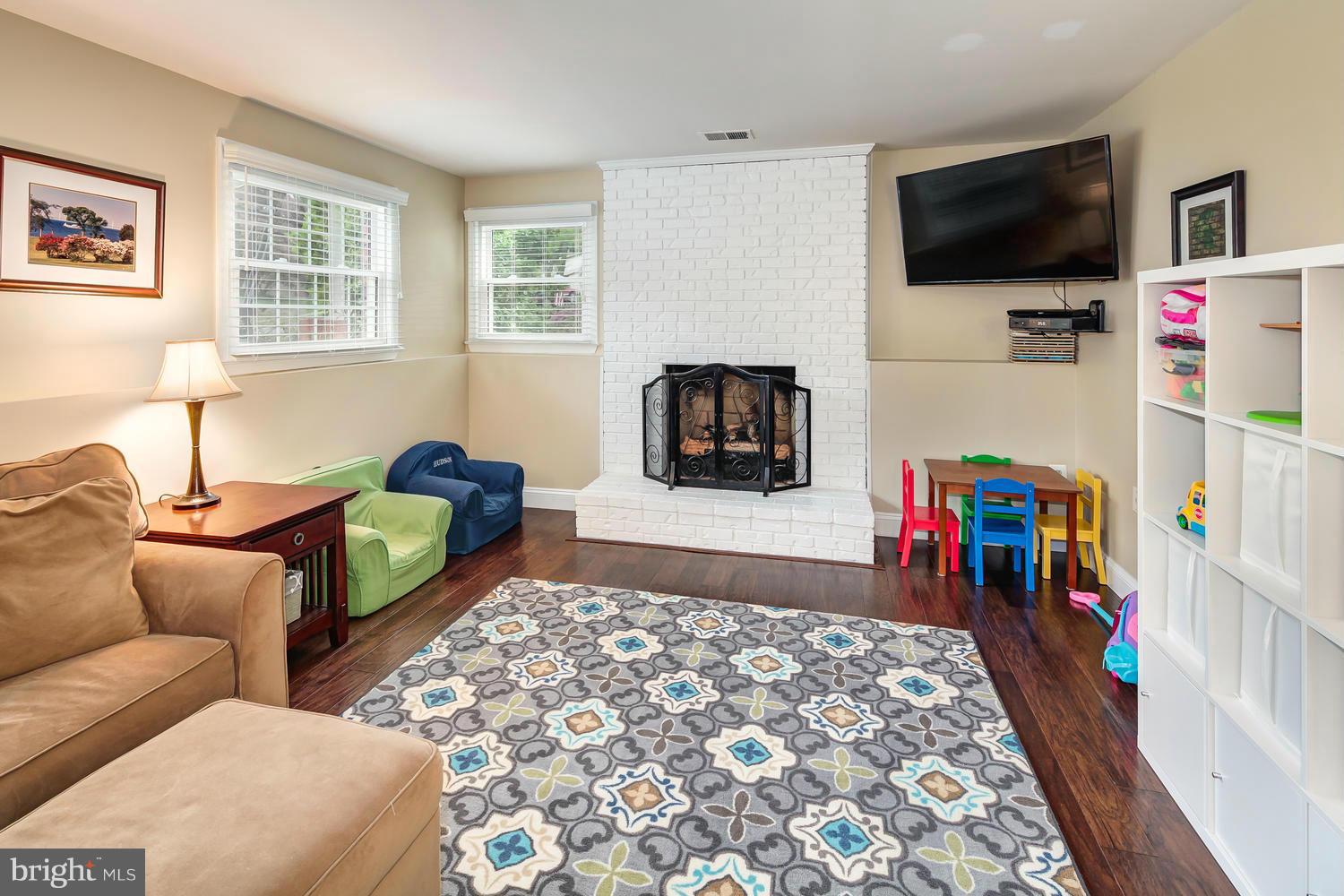 9148 Rockefeller Lane Springfield, VA 22153 - Photo 23 of 29 a bedroom with furniture and a flat screen tv