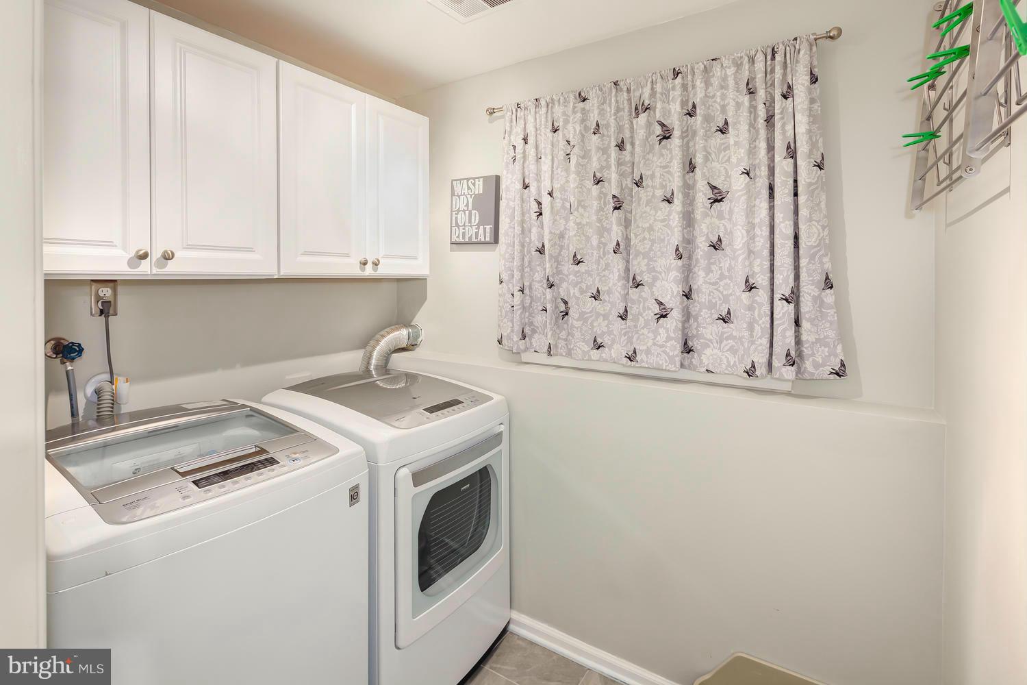 9148 Rockefeller Lane Springfield, VA 22153 - Photo 26 of 29 a utility room with dryer and washer