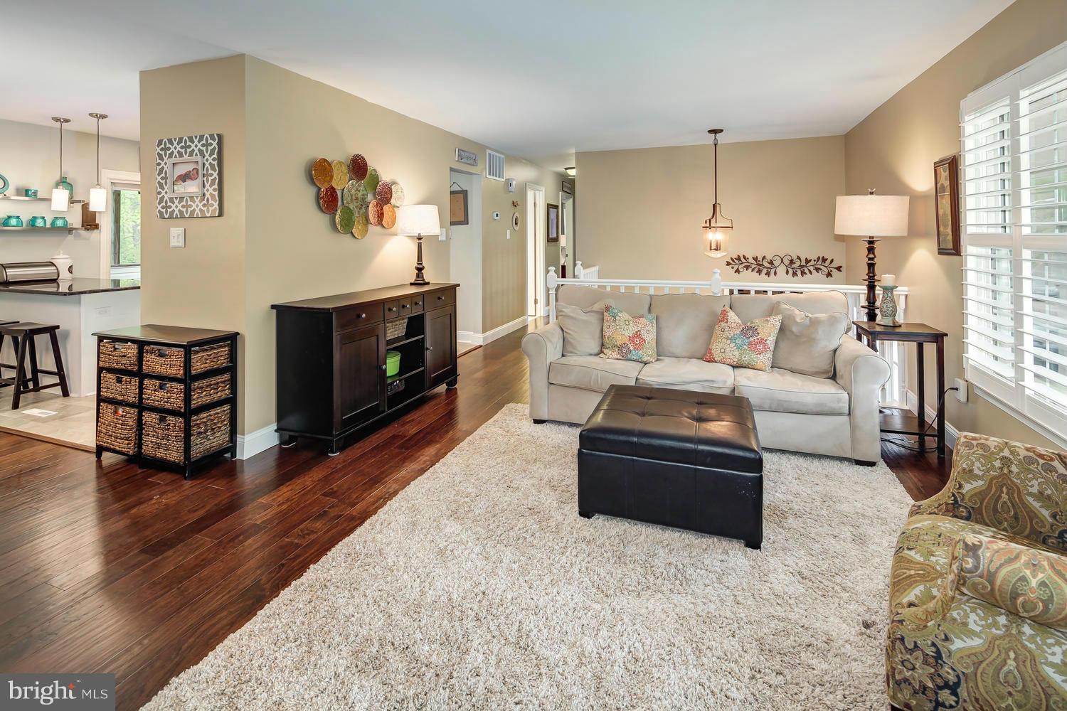 9148 Rockefeller Lane Springfield, VA 22153 - Photo 5 of 29 a living room with furniture and a fireplace