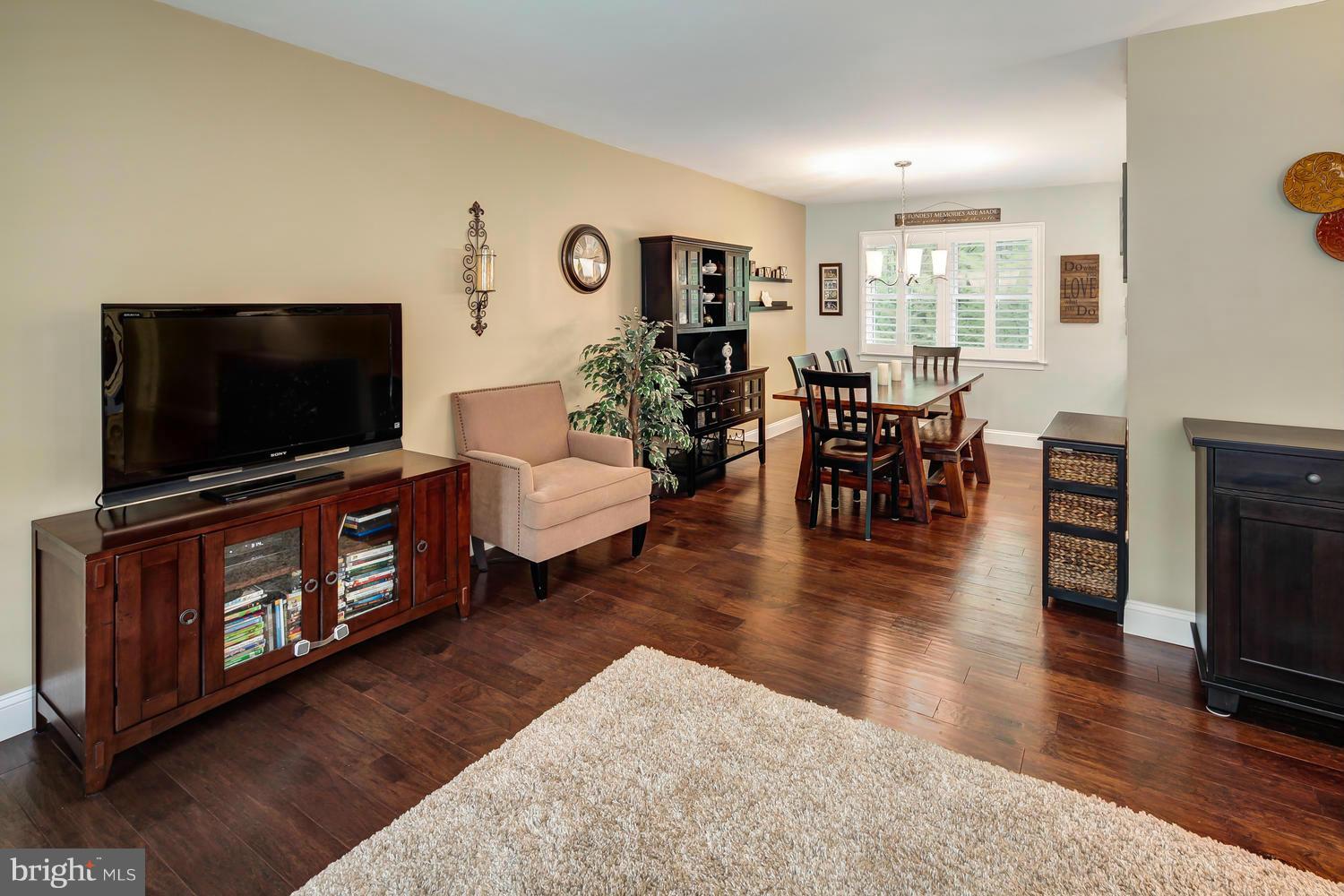 9148 Rockefeller Lane Springfield, VA 22153 - Photo 6 of 29 a living room with furniture and a flat screen tv