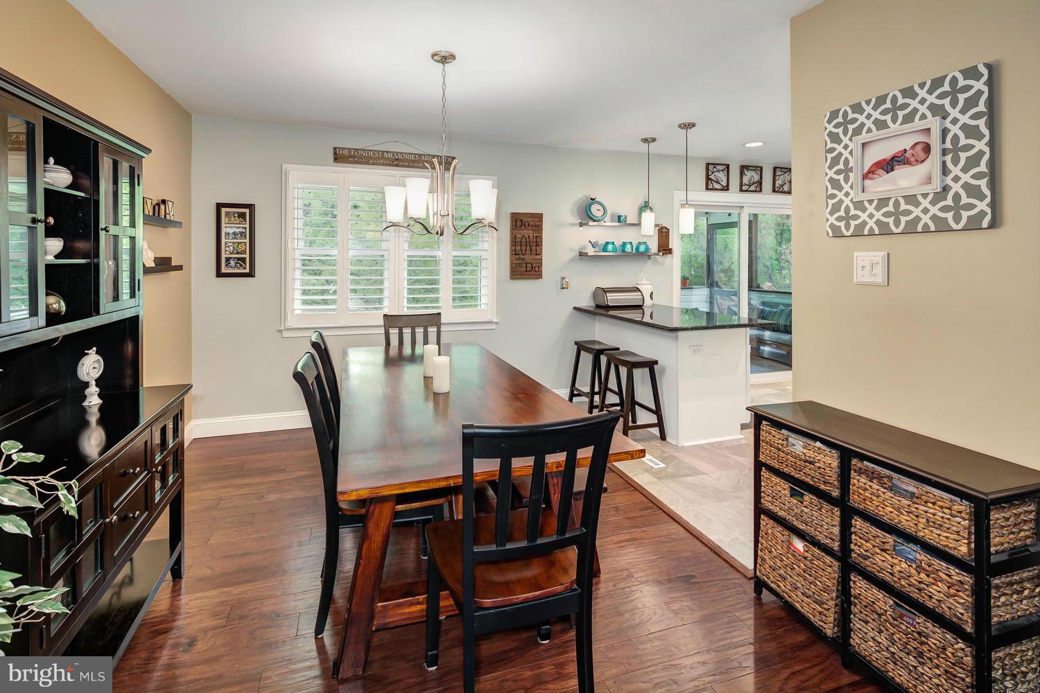 9148 Rockefeller Lane Springfield, VA 22153 - Photo 9 of 29 a view of a dining room with furniture window and wooden floor
