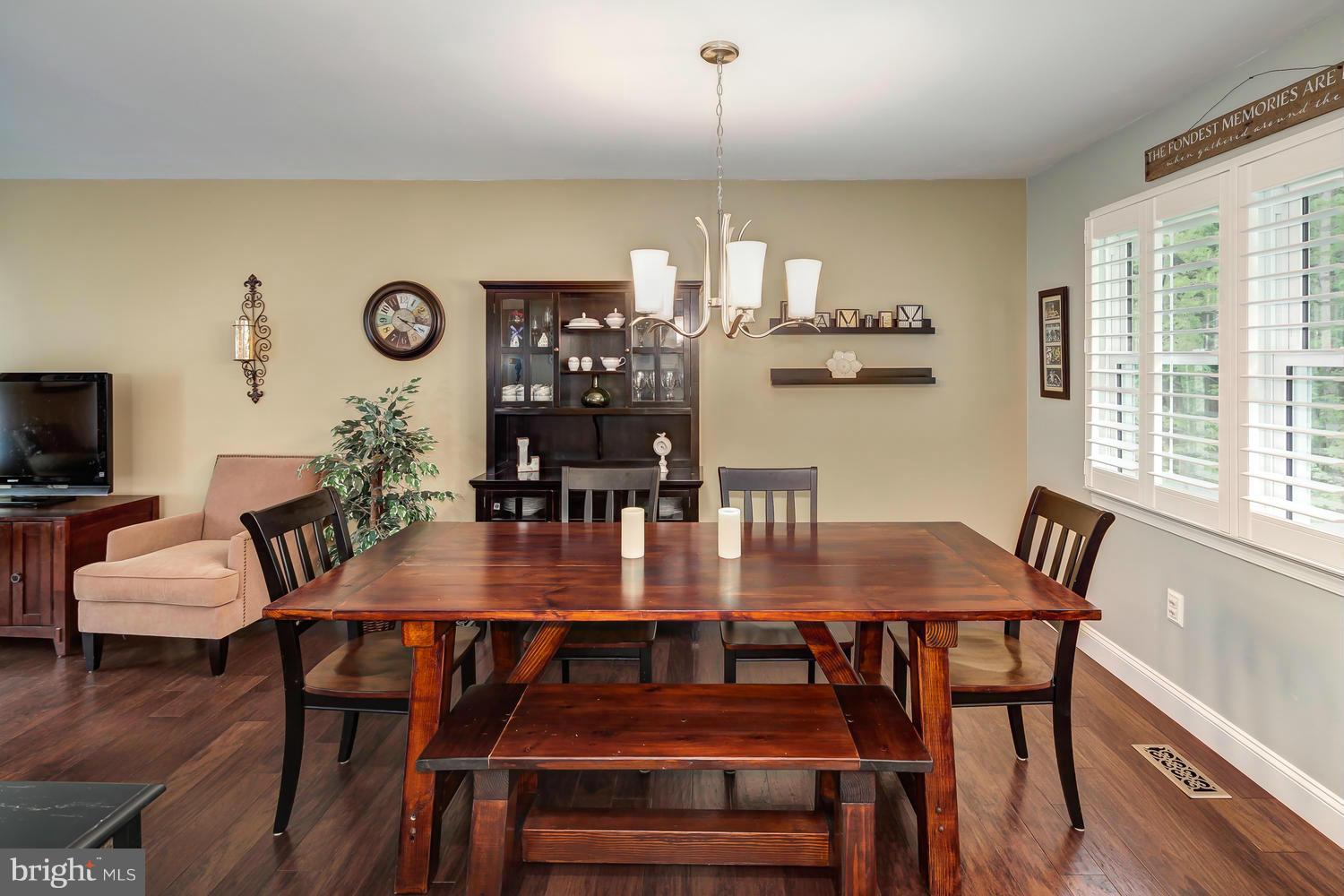 9148 Rockefeller Lane Springfield, VA 22153 - Photo 10 of 29 a view of a dining room with furniture and wooden floor