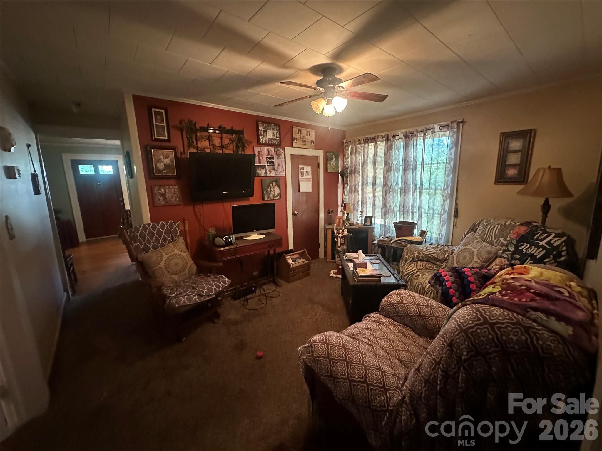 241 Wilson Road Rutherfordton, NC 28139 - Photo 8 of 14 a living room with furniture and a flat screen tv