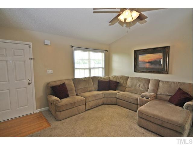 144 Wagner Road Willow Spring, NC 27592 - Photo 2 of 19 a living room with furniture and a window