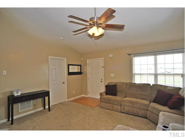 144 Wagner Road Willow Spring, NC 27592 - Photo 6 of 19 a living room with furniture and a window