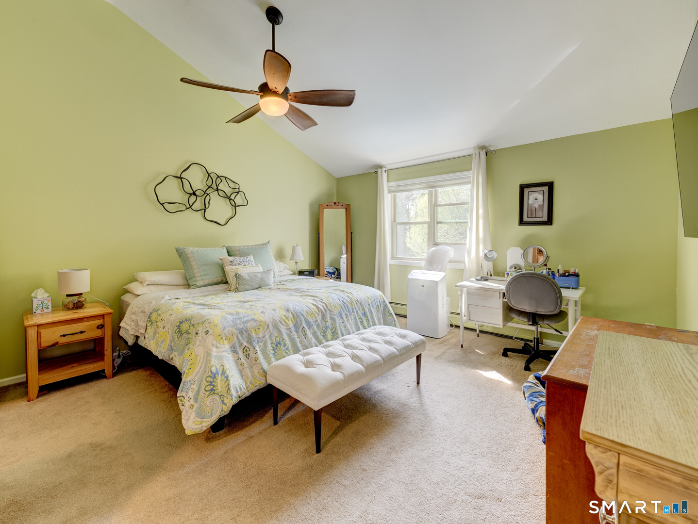 97 Lair Road New Hartford, CT 06057 - Photo 26 of 39 a bedroom with a bed and a chandelier