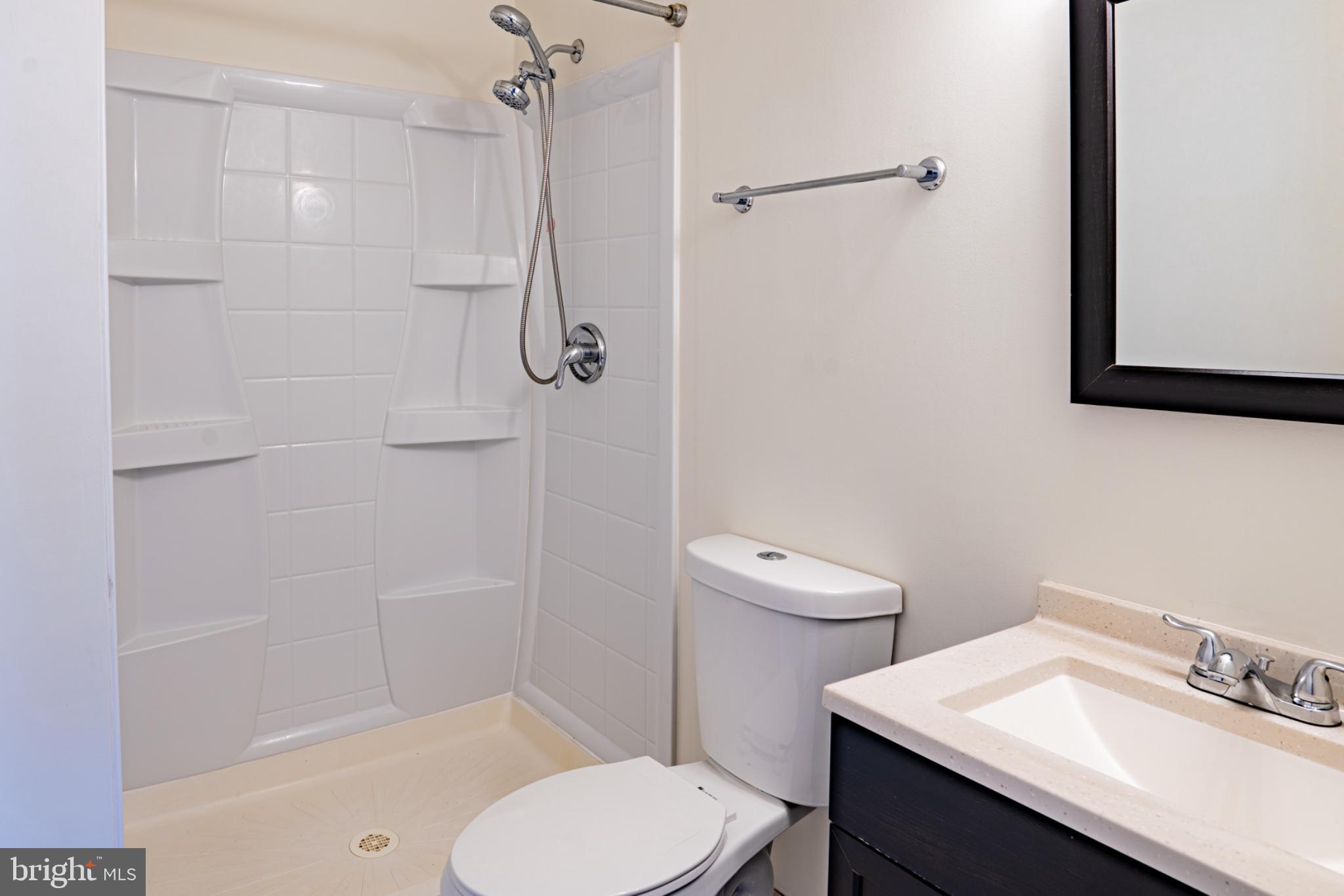 2913 Seminole Road Woodbridge, VA 22192 - Photo 18 of 34 a bathroom with a sink toilet and shower
