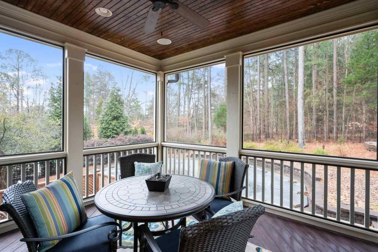 6017 Reedy Creek Road Raleigh, NC 27607 - Photo 28 of 30 Overlooking the pool with a ceiling fan and surround sound speakers. Direct access to deck and kitchen. Private screened porch