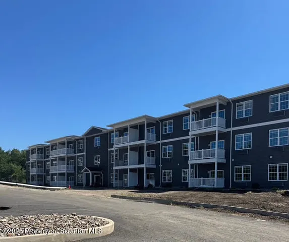 a view of an buildings with a street