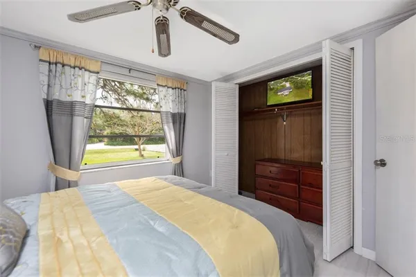 a bedroom with a bed and a dresser