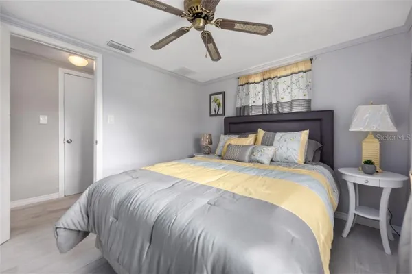 a bedroom with a bed and window