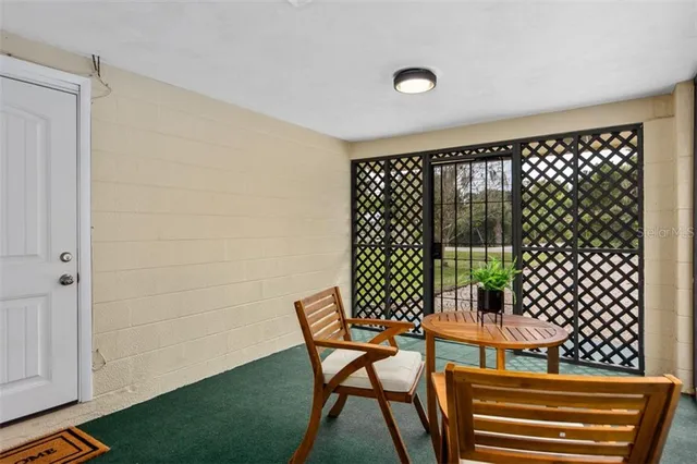 a view of a room with furniture and wooden floor