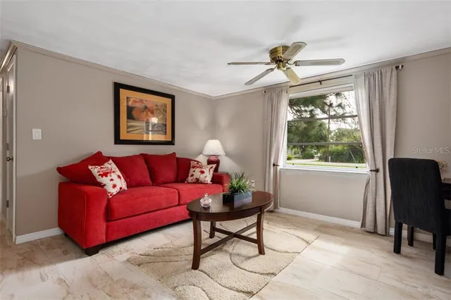 a living room with furniture and a window