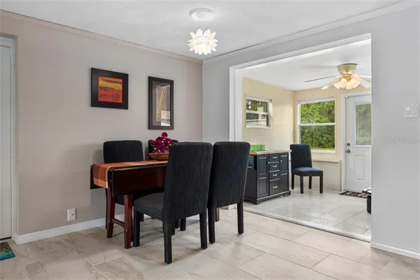 a living room with furniture a window and a chandelier