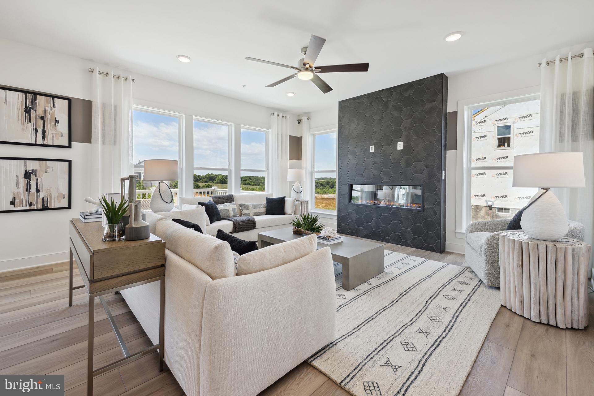 14404 Dowitcher Way Boyds, MD 20841 - Photo 12 of 54 a living room with furniture and a large window