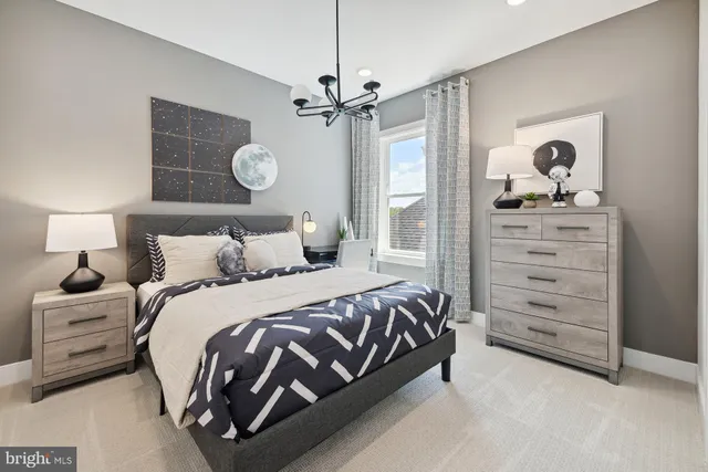 a bedroom with a bed and cabinet