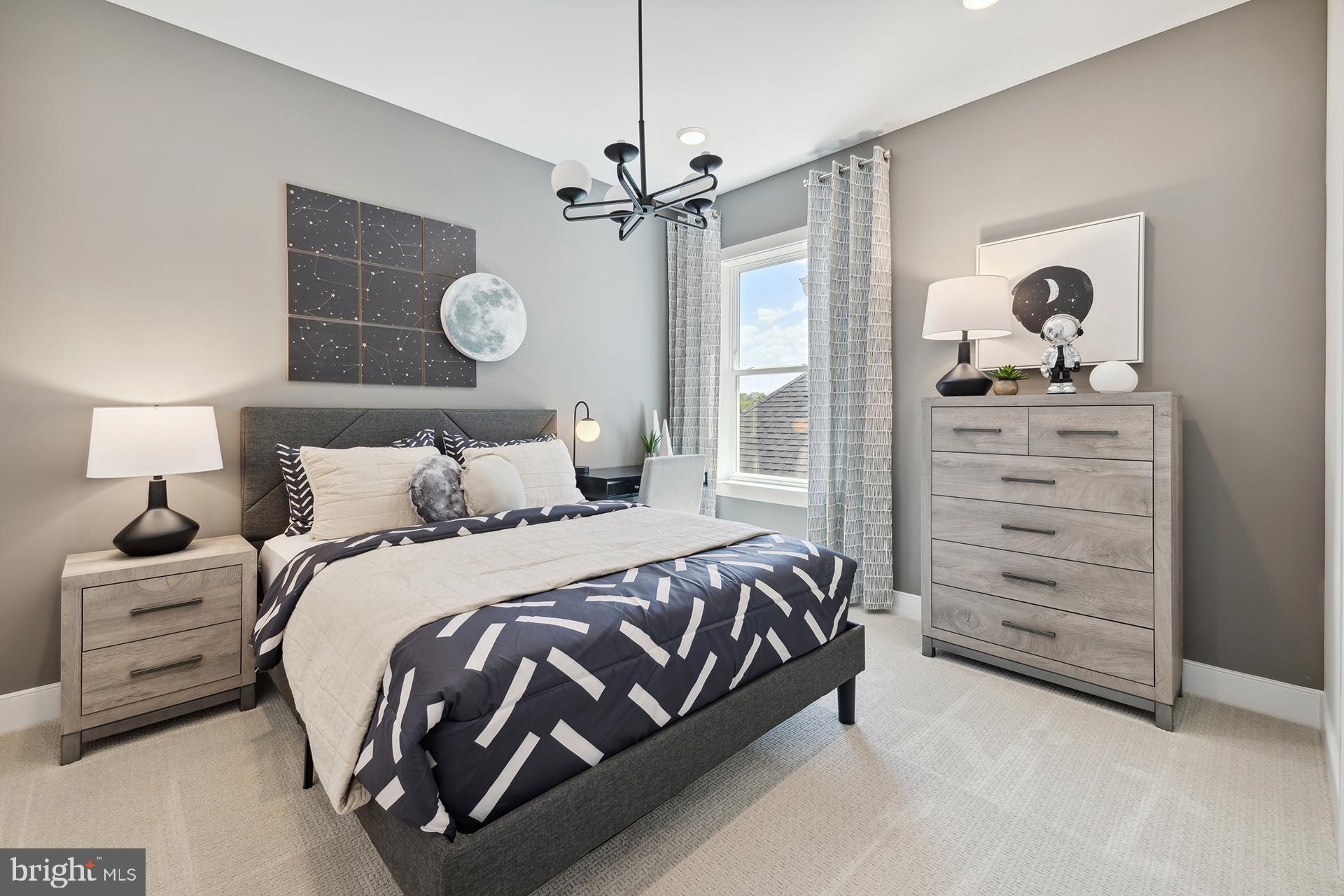 14404 Dowitcher Way Boyds, MD 20841 - Photo 18 of 54 a bedroom with a bed and cabinet