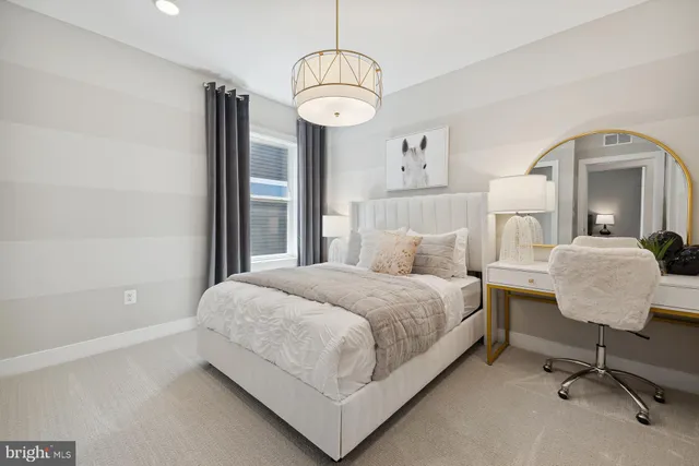 a bedroom with a bed and a mirror