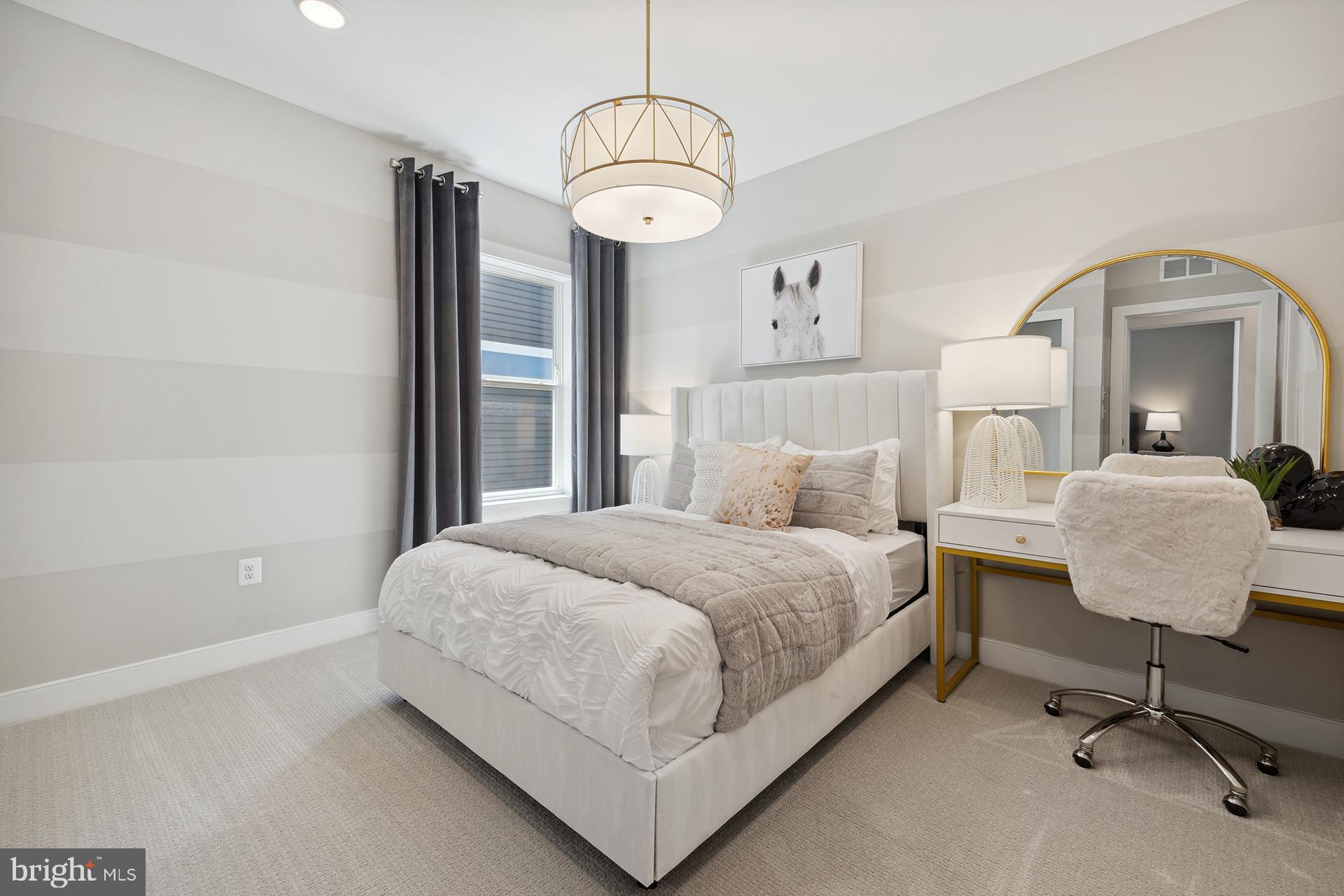 14404 Dowitcher Way Boyds, MD 20841 - Photo 21 of 54 a bedroom with a bed and a mirror