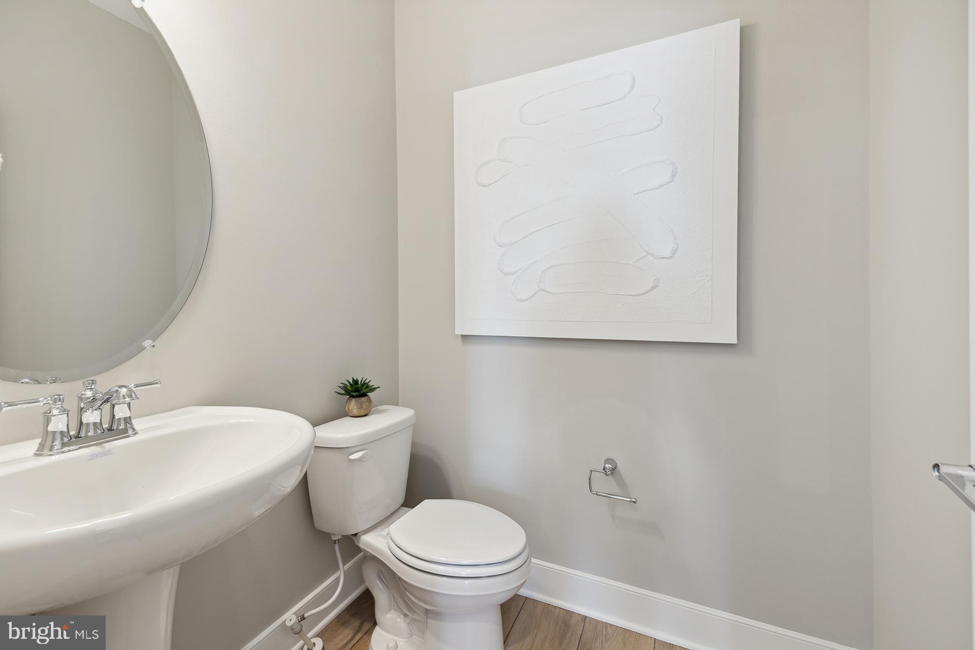 14404 Dowitcher Way Boyds, MD 20841 - Photo 22 of 54 a white toilet sitting next to a white sink