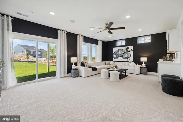 a bed room with furniture and a flat screen tv