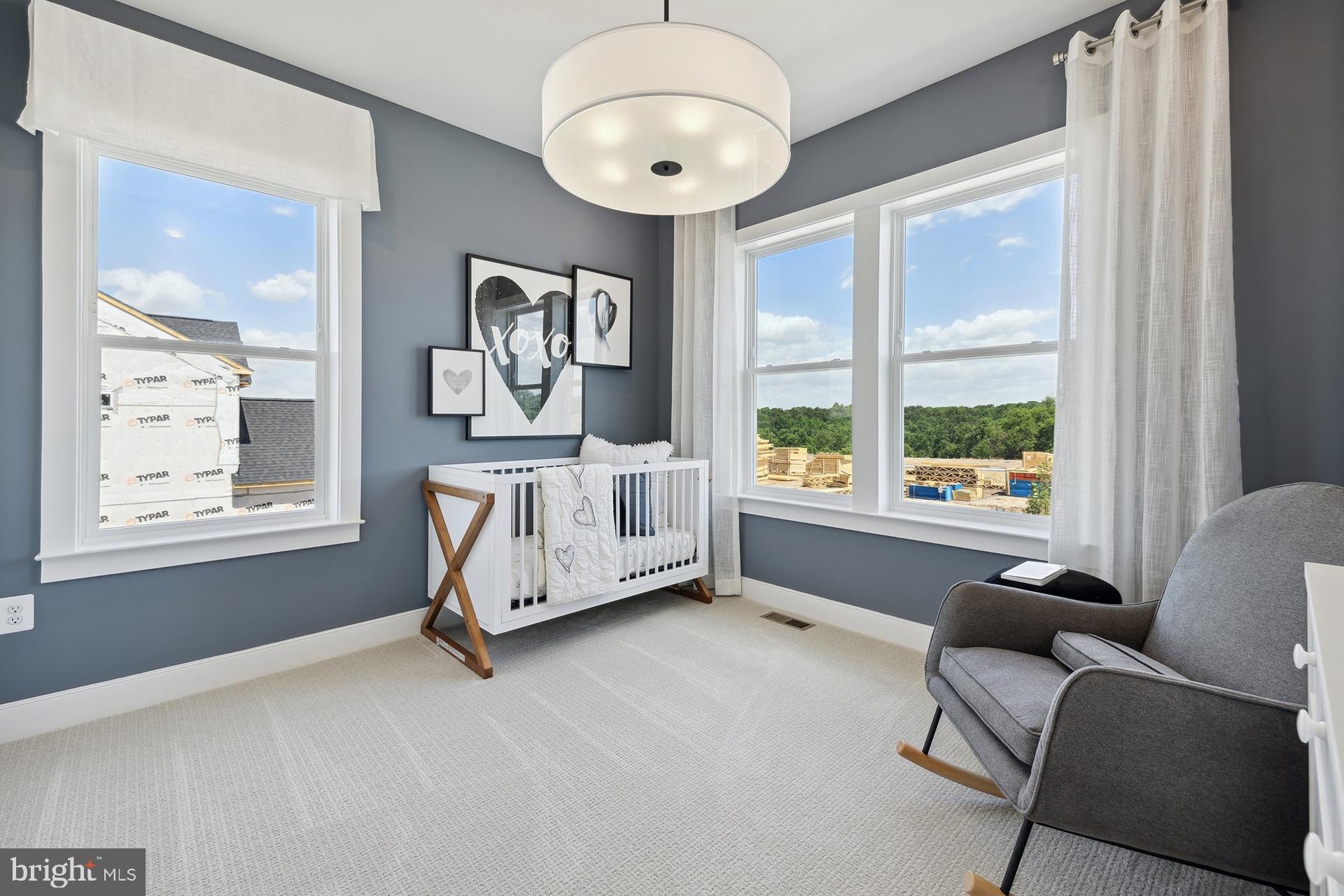 14404 Dowitcher Way Boyds, MD 20841 - Photo 28 of 54 a spacious bedroom with a bed and a large window
