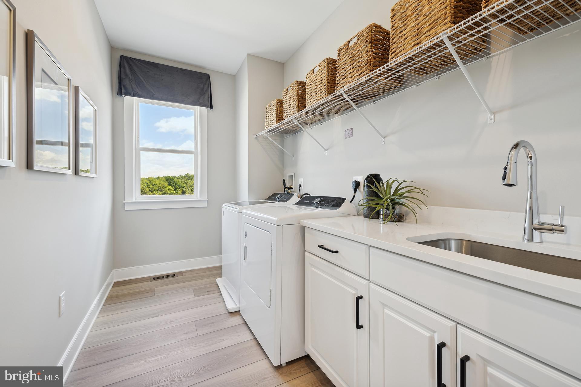 14404 Dowitcher Way Boyds, MD 20841 - Photo 29 of 54 a kitchen with a sink and cabinets