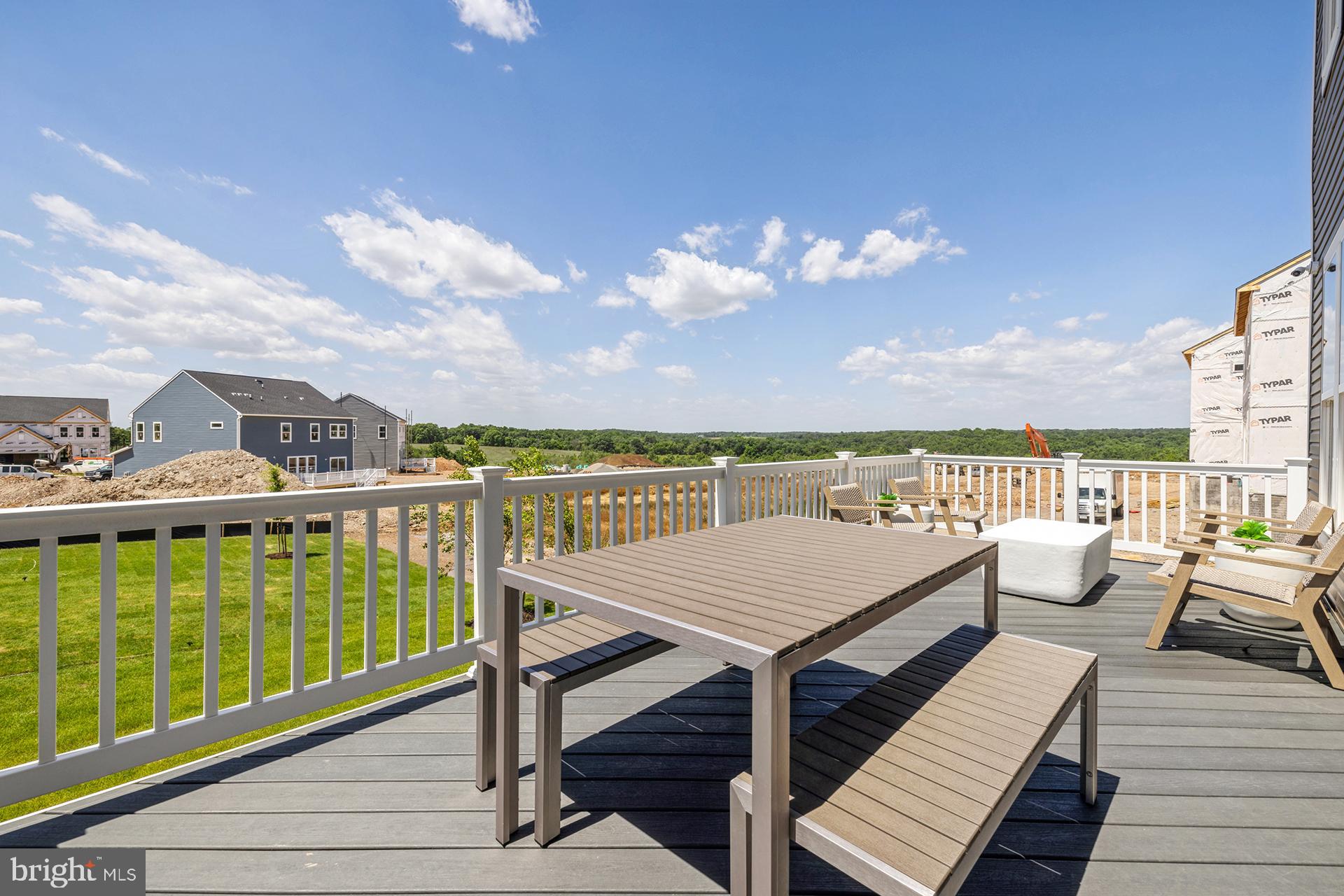 14404 Dowitcher Way Boyds, MD 20841 - Photo 31 of 54 a view of a balcony with wooden floor and city view