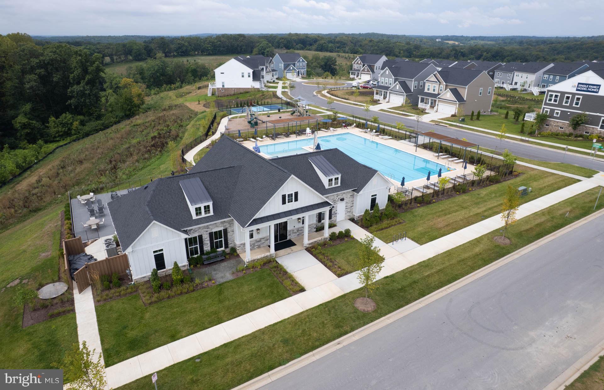 14404 Dowitcher Way Boyds, MD 20841 - Photo 44 of 54 an aerial view of a house with a garden and lake view