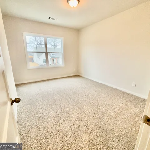 a view of a lake with couches in the patio