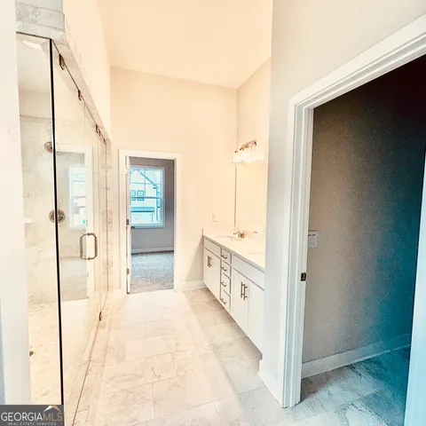 a front view of a house with a yard table and chairs