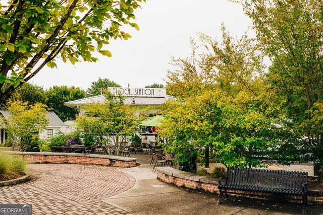 a view of a building with sitting area