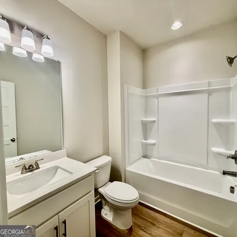 an empty room with a chandeliers