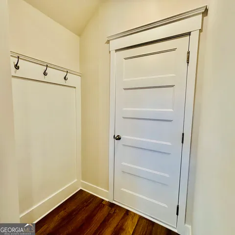 a spacious bathroom with a shower sink and mirror