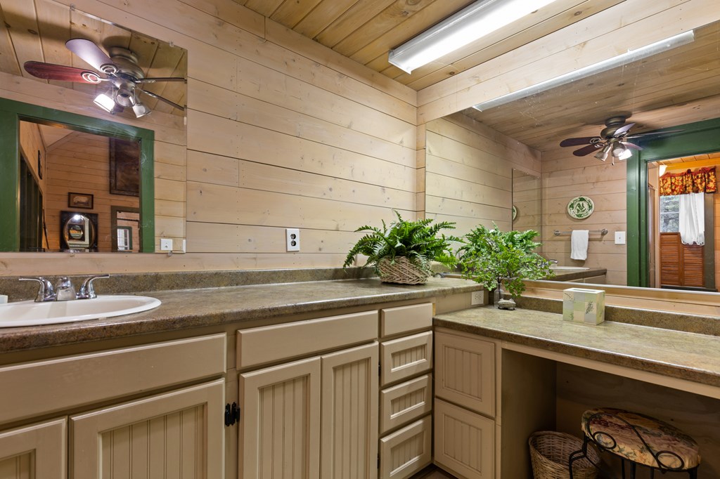 540 Old Mill Road Suches, GA 30572 - Photo 17 of 51 a bathroom with a sink and a mirror