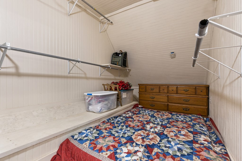 540 Old Mill Road Suches, GA 30572 - Photo 24 of 51 a bedroom with a bed and cabinets