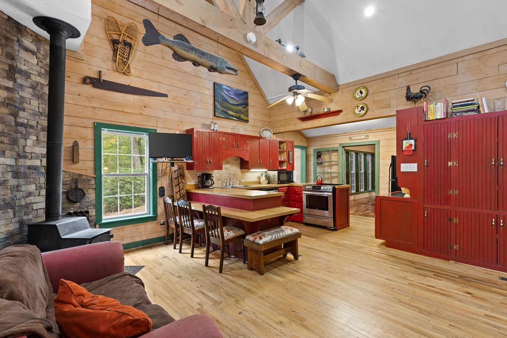 540 Old Mill Road Suches, GA 30572 - Photo 27 of 51 a living room with furniture a wooden floor and a window