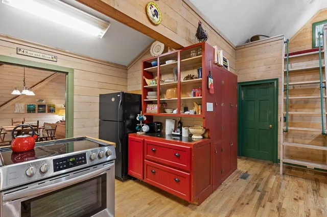 a bedroom with a bed and a fireplace