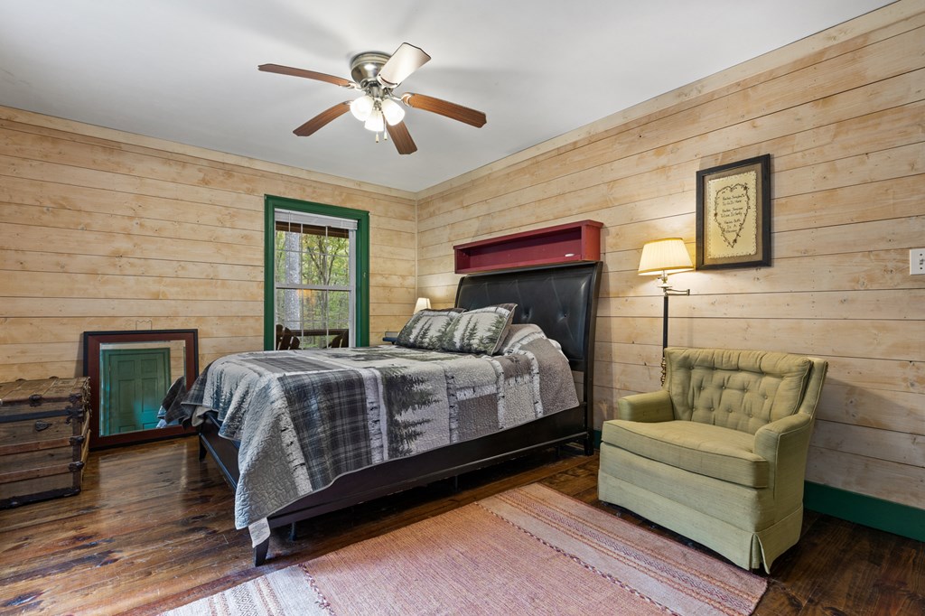 540 Old Mill Road Suches, GA 30572 - Photo 31 of 51 a bedroom with a bed and a fireplace