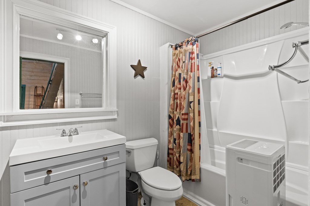 540 Old Mill Road Suches, GA 30572 - Photo 32 of 51 a bathroom with a sink toilet and shower