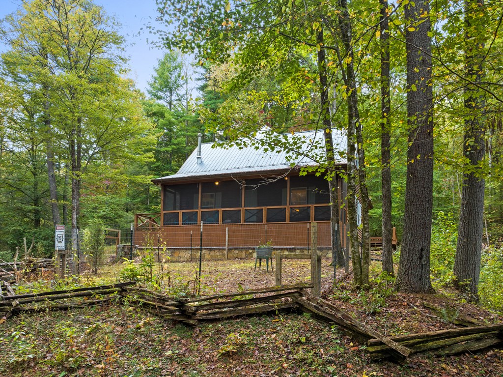 540 Old Mill Road Suches, GA 30572 - Photo 40 of 51 a view of a backyard with a large tree
