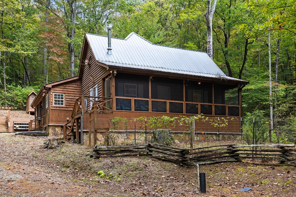 540 Old Mill Road Suches, GA 30572 - Photo 41 of 51 a front view of a house with a yard